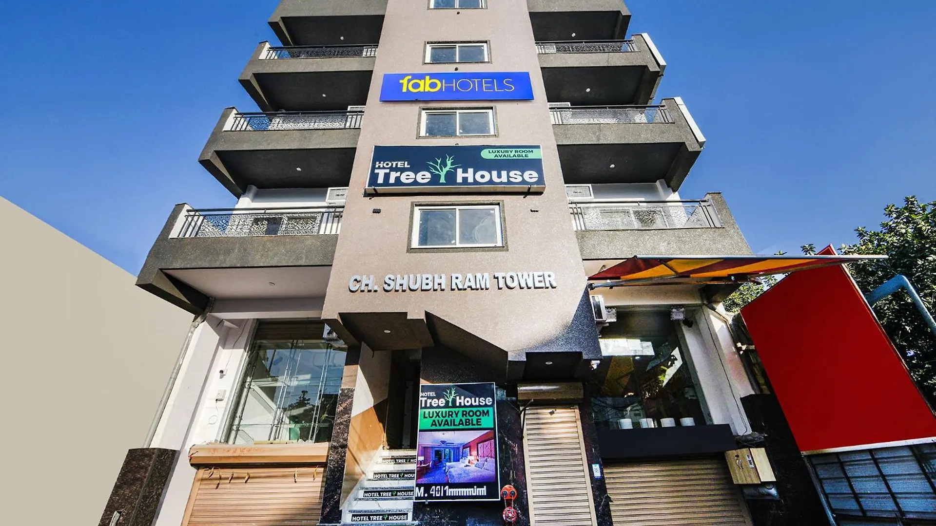 Fabhotel Tree House - Nr Yashobhoomi Convention Centre contacts
